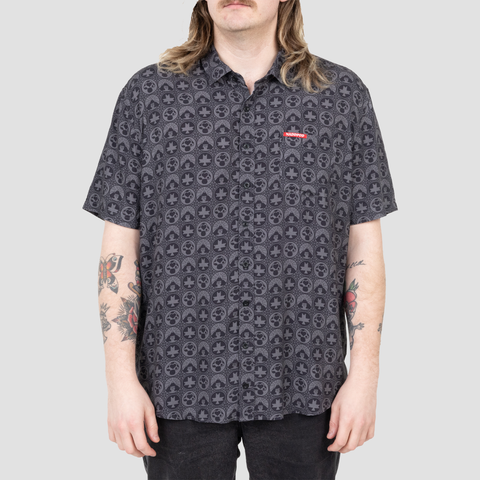 model wearing Black naddpod s/s buttondown