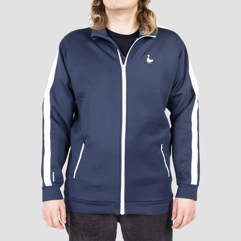 navy and white track jacket on male model with duck on left chest