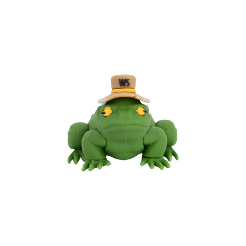 Green frog keychain with a hat on a white background