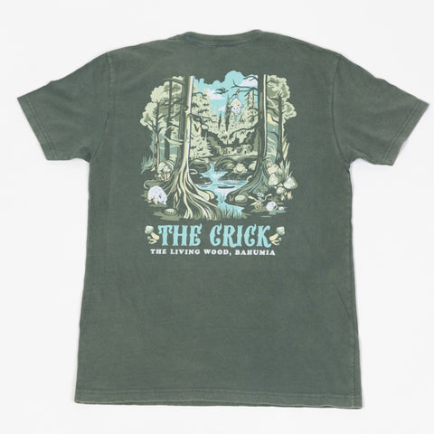 rear view of washed royal pine tee with graphic of crick running through forest with text "THE CRICK THE LIVING WOOD, BAHUMIA"