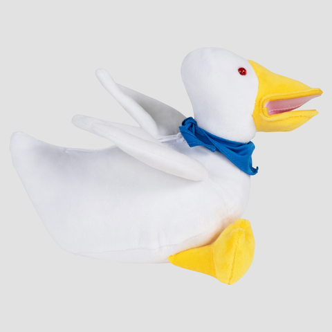 side view of Plush duck with blue handkerchief around neck