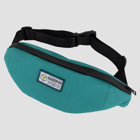Teal Fanny pack with patch with text "NADDPOD SHOUT OUT TO THE 2 CREW"